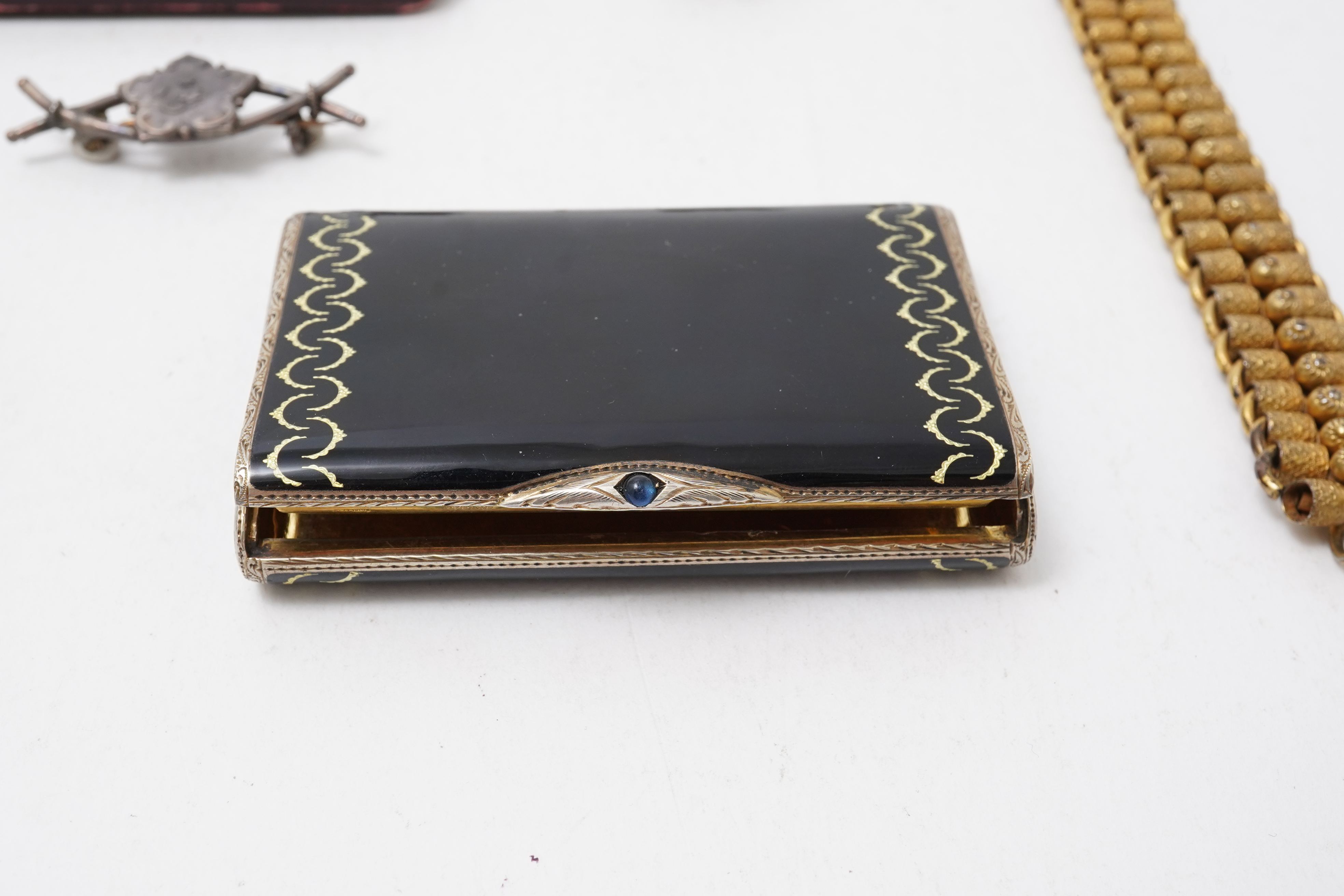 A collection of jewels including an Art Deco silver cigarette case